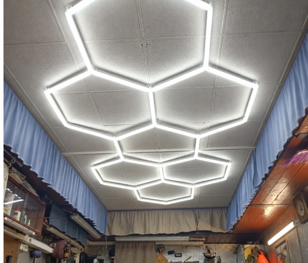 Honeycomb hexagon ceiling light installed on a workshop ceiling